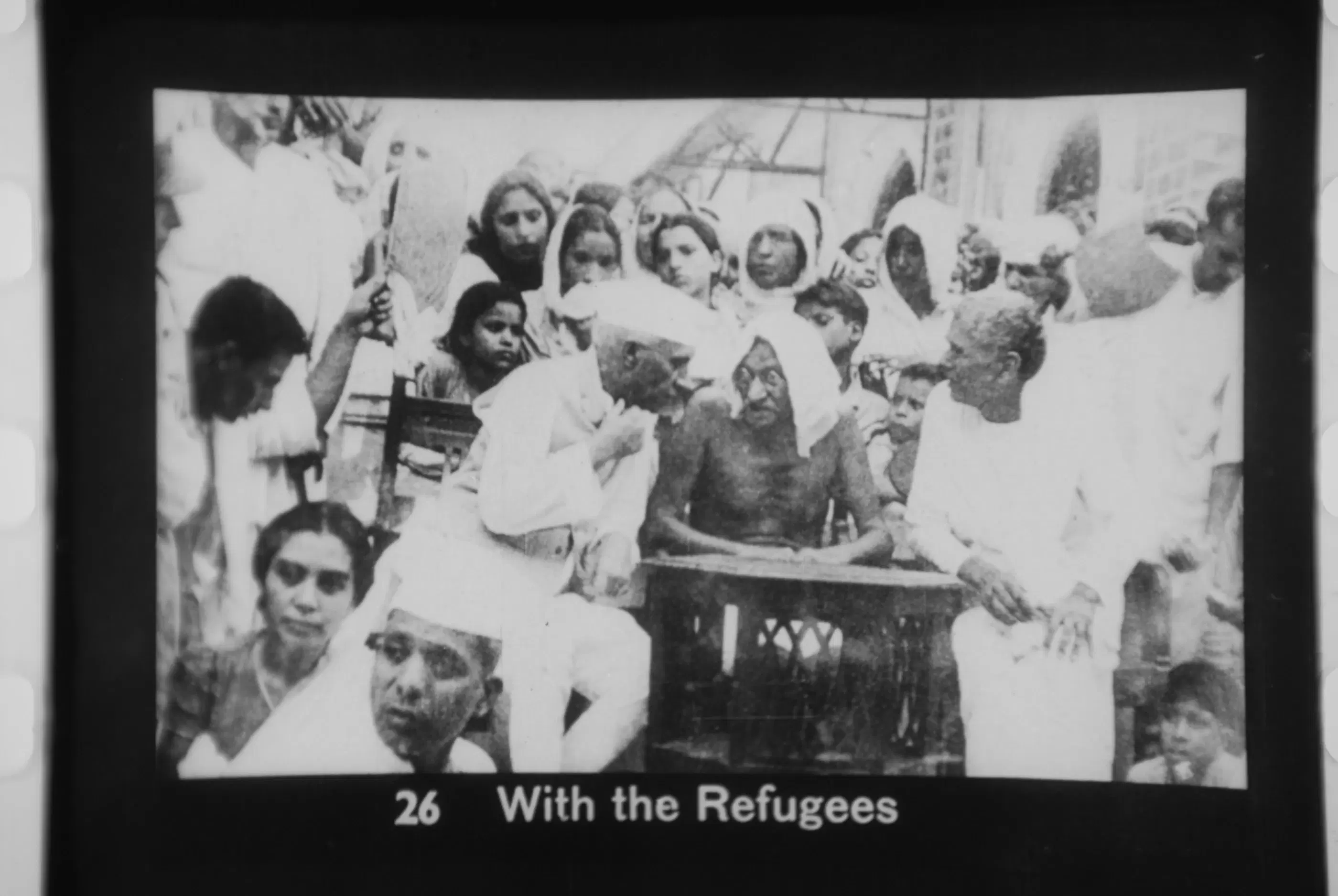 Mahatma Gandhi and Jawaharlal Nehru surrounded by refugees during the 1947 Partition of India.