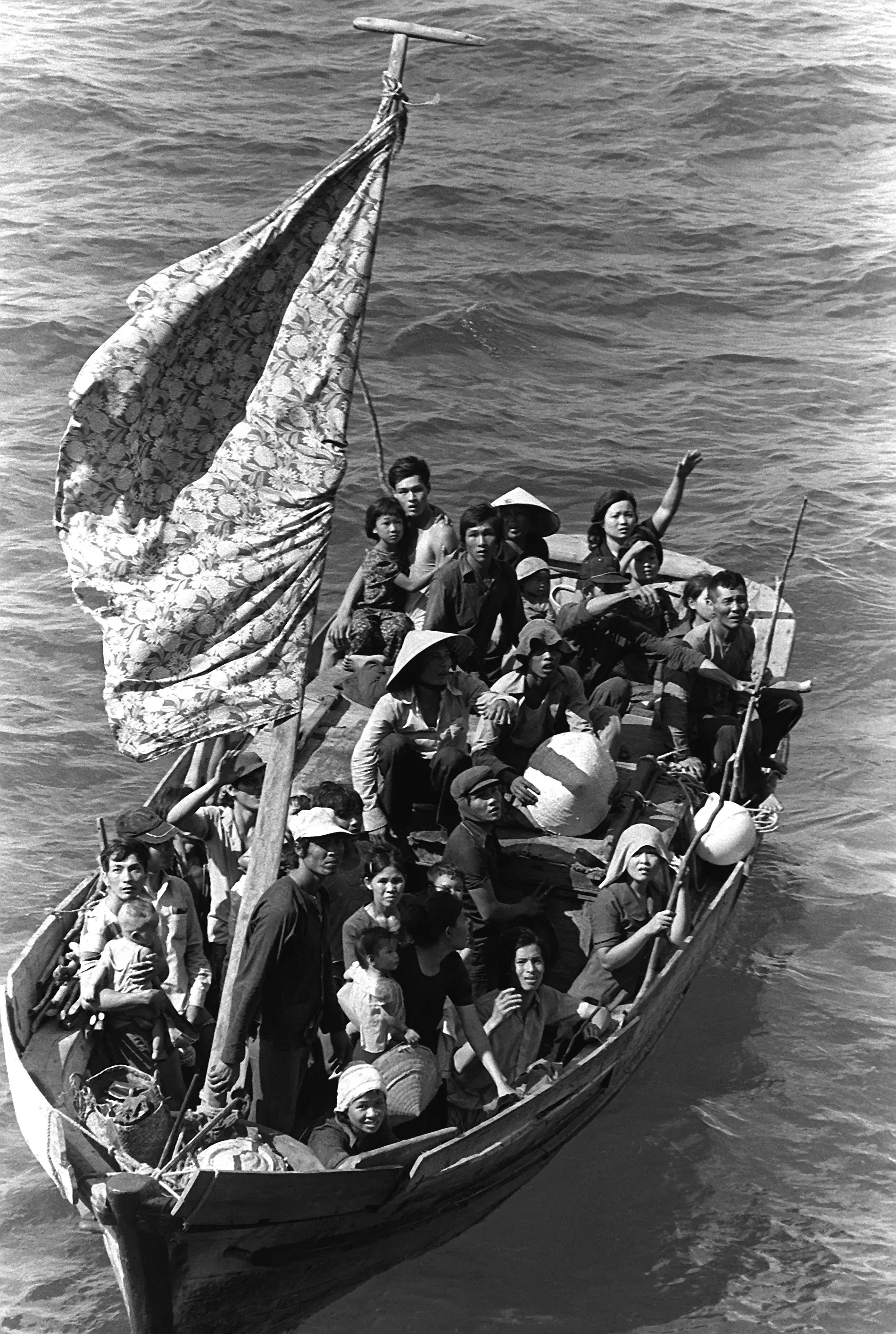 Vietnamese refugees waiting in a small boat during a U.S. Navy rescue in 1984.